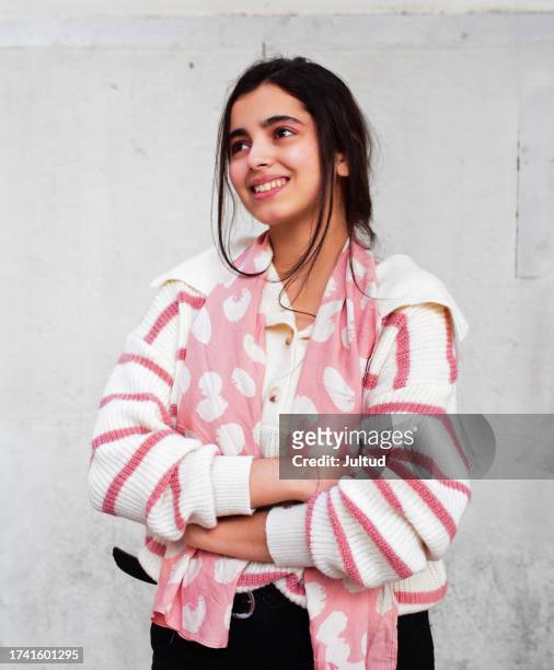 portrait of a beautiful smiling arab teenager - sleeveless sweater stock pictures, royalty-free photos & images