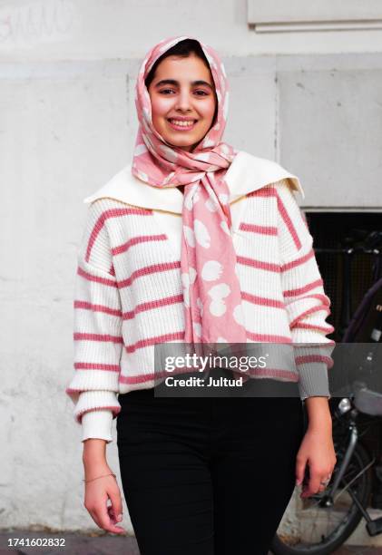 portrait of smiling teenage girl of arab ethnicity, wearing traditional muslim headscarf. outdoors - tank top stock pictures, royalty-free photos & images