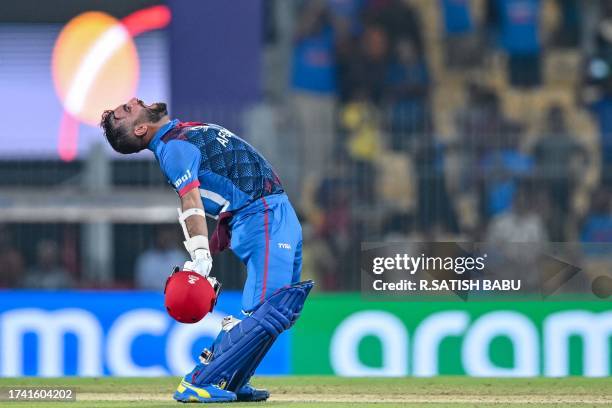 Afghanistan's captain Hashmatullah Shahidi celebrates after winning the 2023 ICC Men's Cricket World Cup one-day international match between Pakistan...