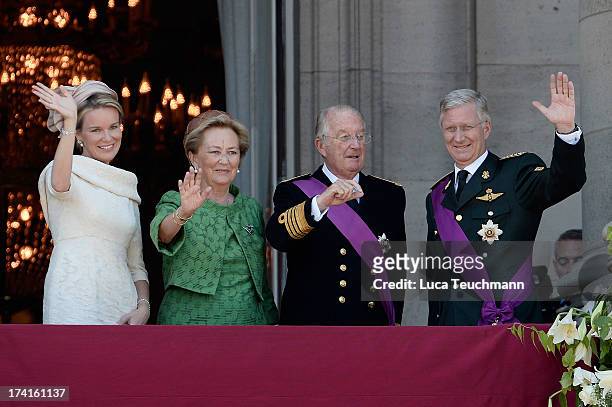 Queen Mathilde of Belgium, Princess Paola of Belgium, King Albert II of Belgium and King Philippe of Belgium greet the audience from the balcony of...