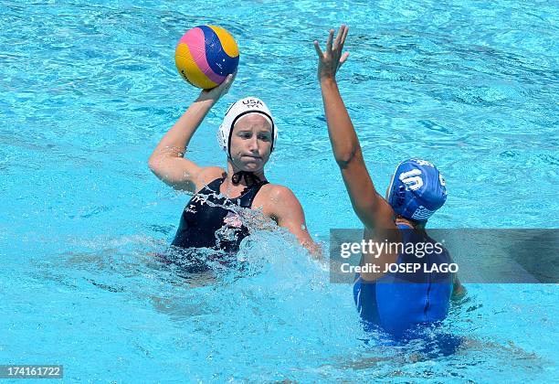 Player Kelly Rulon is held back by Greece's Triantafyllia Manolioudaki during the preliminary round match between the US and Greece during the...