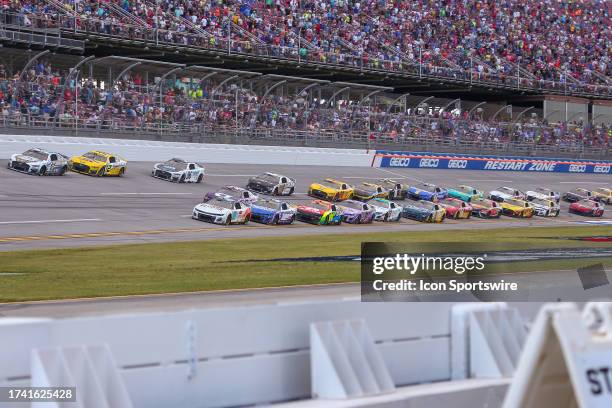 The field races out of the tri oval during the NASCAR Cup Series Playoff YellaWood 500 on October 1, 2023 at Talladega Superspeedway in Talladega, AL.