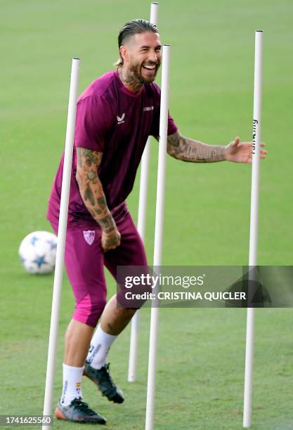 Sevilla's Spanish defender Sergio Ramos attends a training session at the Jose Ramon Cisneros Palacios sports city in Seville on October 23 on the...