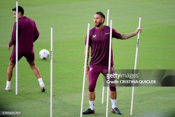 Sevilla's Spanish defender Sergio Ramos attends a training session at the Jose Ramon Cisneros Palacios sports city in Seville on October 23 on the...