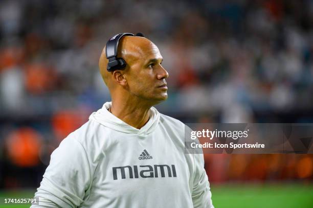 Miami defensive line coach Jason Taylor stands on the field before the start of the college football game between the Clemson Tigers and the...