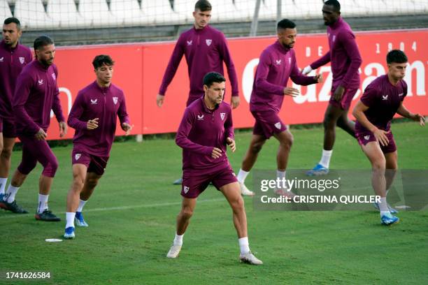 Sevilla's Spanish midfielder Jesus Navas and teammates attend a training session at the Jose Ramon Cisneros Palacios sports city in Seville on...