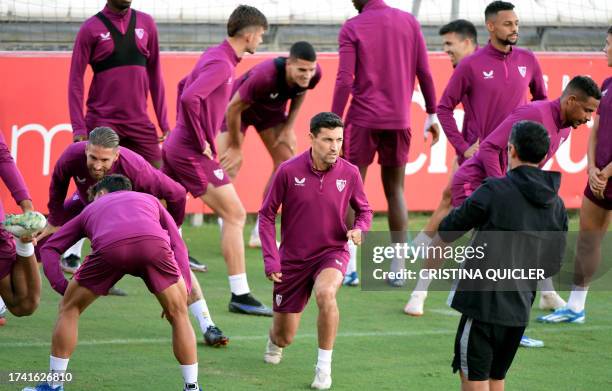 Sevilla's Spanish midfielder Jesus Navas and teammates attend a training session at the Jose Ramon Cisneros Palacios sports city in Seville on...