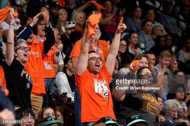 Connecticut Sun fans celebrate during round two game four of the 2023 WNBA Playoffs on October 1, 2023 at the Mohegan Sun Arena in Uncasville,...
