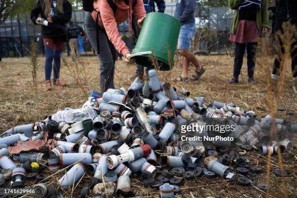 Protesters collect remnants of tear gas canisters used against them by riot police. Protesters decided to create a ZAD in a farm 'La Cremade' nearby...