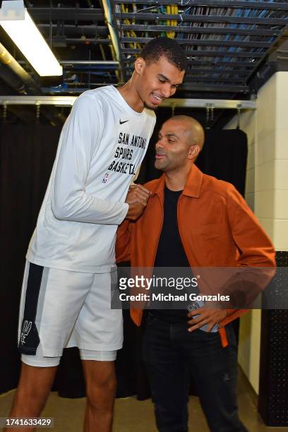 Legend Tony Parker and Victor Wembanyama of the San Antonio Spurs greet each other before the game on October 18, 2023 at the Frost Bank Center in...