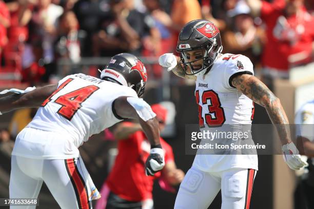 Tampa Bay Buccaneers Wide Receiver Chris Godwin celebrates with Wide Receiver Mike Evans after Evans scored a touchdown during the regular season...