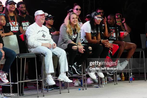 Las Vegas Aces owner, Mark Davis, head coach Becky Hammon, and A'ja Wilson celebrate during the 2023 WNBA championship victory parade and rally on...