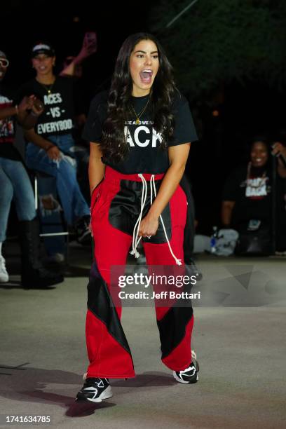 Kelsey Plum of the Las Vegas Aces celebrates during the 2023 WNBA championship victory parade and rally on the Las Vegas Strip on October 23, 2023 in...