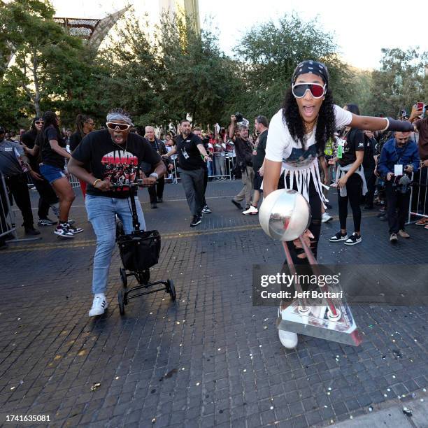 Chelsea Gray and A'ja Wilson of the Las Vegas Aces celebrate during the 2023 WNBA championship victory parade and rally on the Las Vegas Strip on...