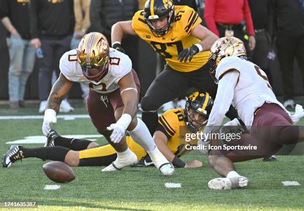 Minnesota defensive lineman Anthony Smith jumps on a fumble during a college football game between the Minnesota Golden Gophers and the Iowa Hawkeyes...