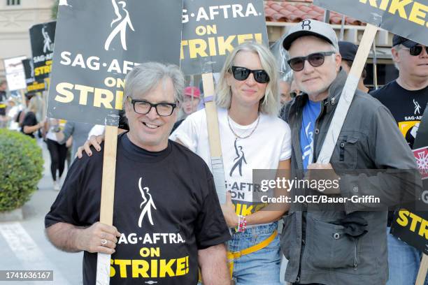 Robert Carradine, Ever Carradine and Bradley Whitford are seen on the SAG-AFTRA picket line at Warner Brothers Studios on October 23, 2023 in Los...