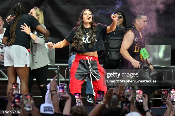 Kelsey Plum of the Las Vegas Aces celebrates during the 2023 WNBA championship victory parade and rally on the Las Vegas Strip on October 23, 2023 in...