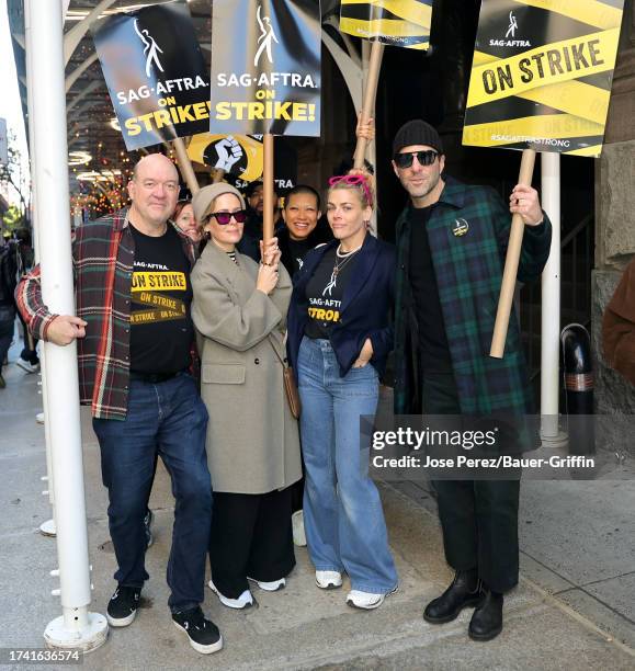 John Carroll Lynch, Sarah Paulson, Busy Philipps and Zachary Quinto are seen at the SAG-AFTRA picket line on October 23, 2023 in New York City.