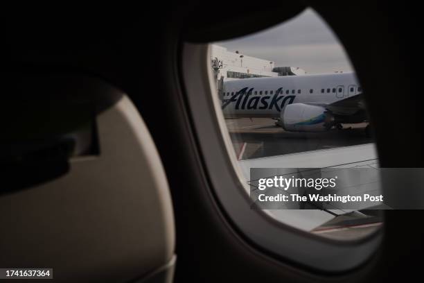 An Alaskan Airlines plane is seen from a Horizon Air plane leaving Ted Stevens International Airport in Anchorage, AK on Sept. 19, 2023.