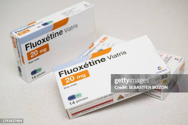 This picture taken on October 23 shows Fluoxetine medication boxes, an antidepressant for the treatment of severe depression, in a pharmacy in...