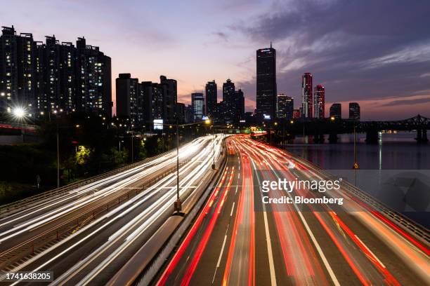 Light trails left by moving traffic in the Yeouido financial district of Seoul, South Korea, on Sunday, Oct. 22, 2023. South Korea is scheduled to...