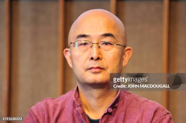 Chinese dissident writer Liao Yiwu addresses a press conference in Berlin on September 16, 2010. Liao, who was prevented by the Chinese authorities...