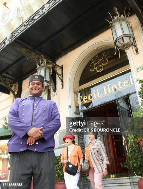Doorman Anwar stands next to the entrance of the Cecil Hotel in Alexandria, 19 June 2007. It took exactly half a century for the Metzger family to...