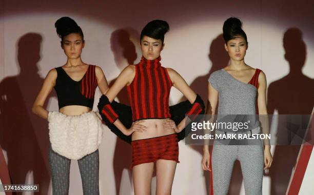 Models wear knitwear designed by local Chinese designers for the German fashion label Stoll at a fashion show in Shanghai 01 September 2006. Chinese...