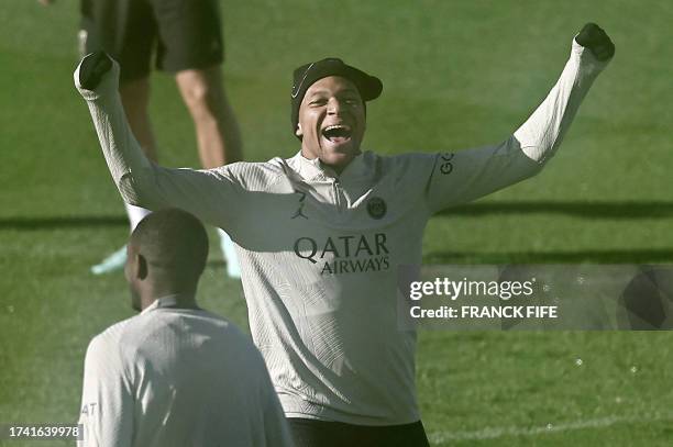 Paris Saint-Germain's French forward Kylian Mbappe takes part in a training session in Poissy, west of Paris, on October 24 on the eve of their UEFA...