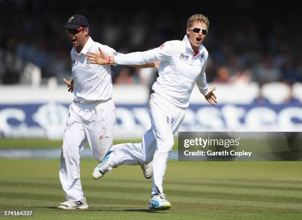 Joe Root of England celebrates the wicket of Michael Clarke of Australia with Jonathan Trott during day four of the 2nd Investec Ashes Test match...