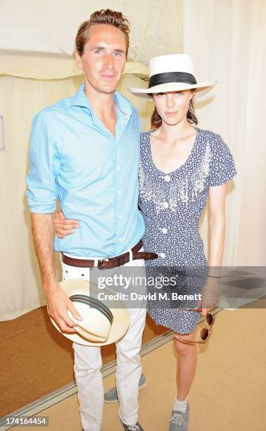 Otis Ferry and Edie Campbell attend the Veuve Clicquot Gold Cup Final at Cowdray Park Polo Club on July 21, 2013 in Midhurst, England.