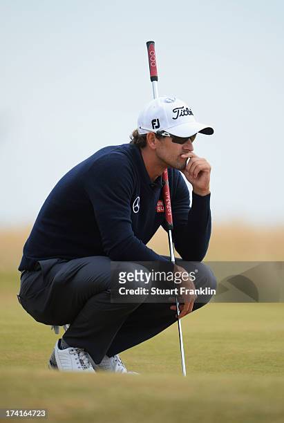 Adam Scott of Australia lines up a putt on the fifth hole during the final round of the 142nd Open Championship at Muirfield on July 21, 2013 in...