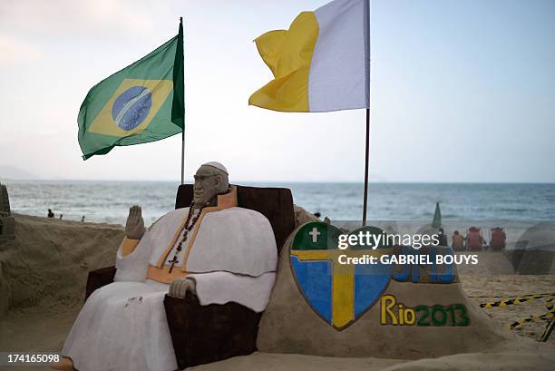 View of a sand sculpture depicting Pope Francis, in Copacabana beach in Rio de Janeiro on July 21, 2013. Pope Francis is due to arrive in Rio on July...