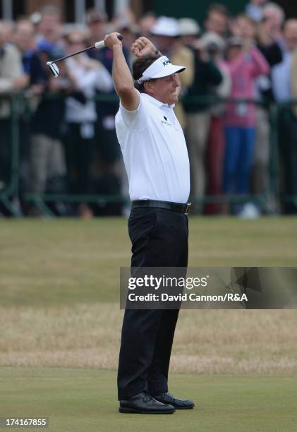 Phil Mickelson of the United States celebrates holing a birdie putt on the 18th green during the final round of the 142nd Open Championship at...