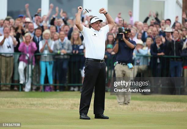 Phil Mickelson of the United States reacts to a birdie putt on the 18th hole during the final round of the 142nd Open Championship at Muirfield on...