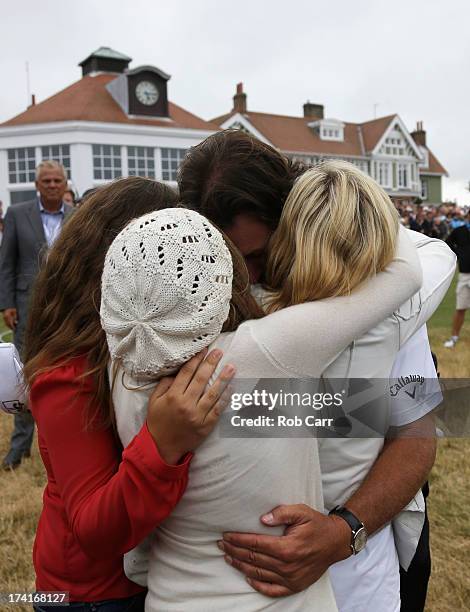 Phil Mickelson of the United States hugs wife Amy and children Evan, Amanda and Sophia after finishing the final round of the 142nd Open Championship...