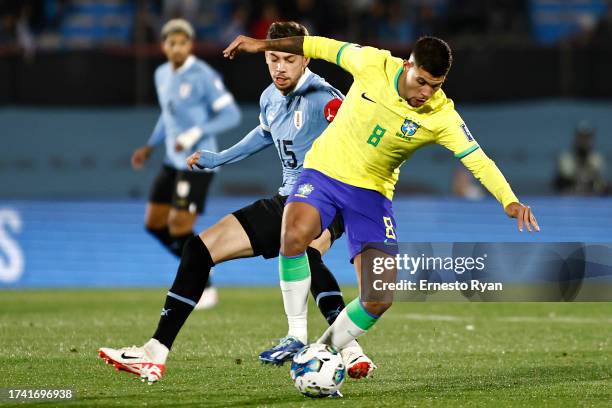 Federico Valverde of Uruguay competes for the ball with Bruno Guimarães of Brazil during the FIFA World Cup 2026 Qualifier match between Uruguay and...