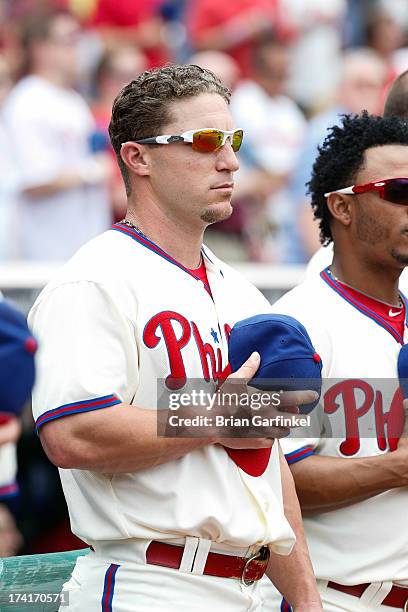 Laynce Nix of the Philadelphia Phillies looks on during the singing of the National Anthem before the game against the Milwaukee Brewers at Citizens...