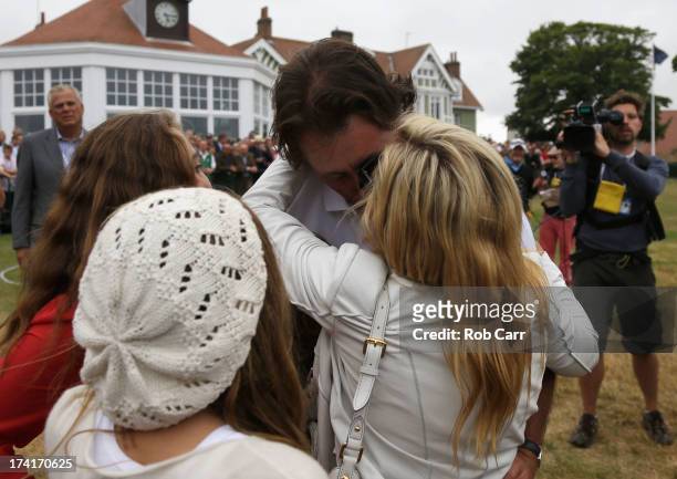 Phil Mickelson of the United States hugs wife Amy and children Evan, Amanda and Sophia after finishing the final round of the 142nd Open Championship...