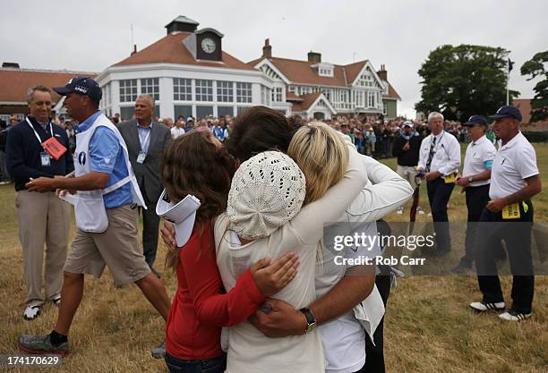 Phil Mickelson of the United States hugs wife Amy and children Evan, Amanda and Sophia after finishing the final round of the 142nd Open Championship...