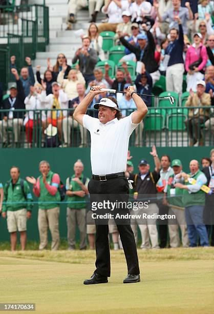 Phil Mickelson of the United States reacts to a birdie putt on the 18th hole during the final round of the 142nd Open Championship at Muirfield on...