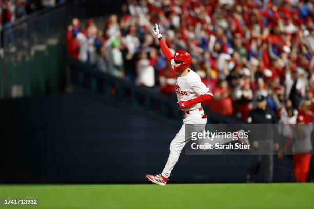 Trea Turner of the Philadelphia Phillies reacts rounding first base after his first inning solo home run against the Arizona Diamondbacks during Game...