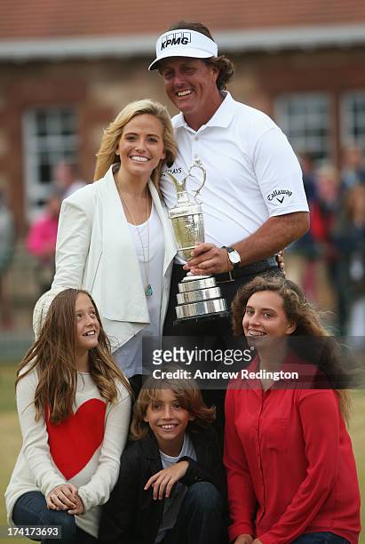 Phil Mickelson of the United States holds the Claret Jug wife Amy and children Evan, Amanda and Sophia after winning the 142nd Open Championship at...