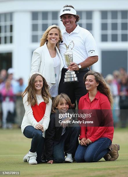 Phil Mickelson of the United States holds the Claret Jug wife Amy and children Evan, Amanda and Sophia after winning the 142nd Open Championship at...