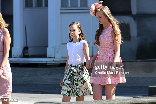 Princess Laetitia Maria of Belgium and Princess Luisa Maria of Belgium attend the Civil and Military Parade during the Abdication Of King Albert II...