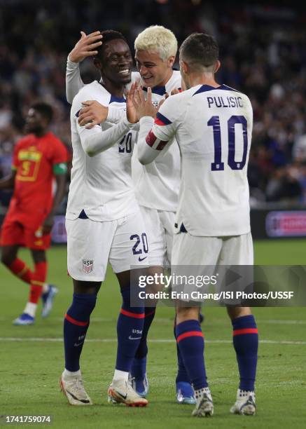 Folarin Balogun of the United States celebrates scoring with Gio Reyna and Christian Pulisic during the first half against Ghana during an...