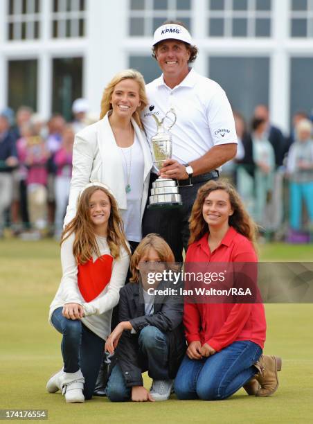 Phil Mickelson of the United States holds the Claret Jug with wife Amy and children Evan, Amanda and Sophia after winning the 142nd Open Championship...