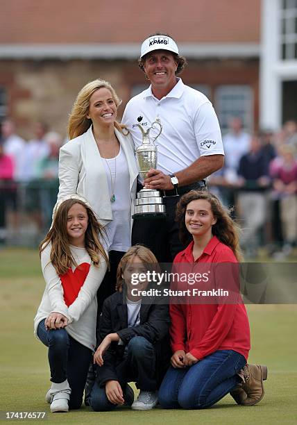 Phil Mickelson of the United States holds the Claret Jug wife Amy and children Evan, Amanda and Sophia after winning the 142nd Open Championship at...