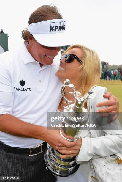 Phil Mickelson of the United States hugs wife Amy while holding the Claret Jug after winning the 142nd Open Championship at Muirfield on July 21,...