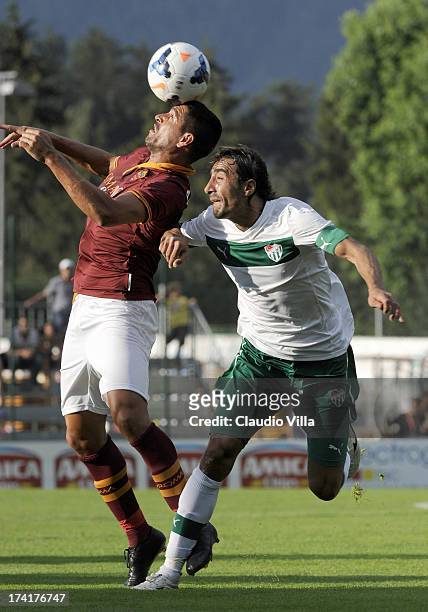 Marco Borriello of AS Roma and Ibrahim Ozturk of Bursaspor Kulubu compete for the ball during the pre-season friendly match between AS Roma and...